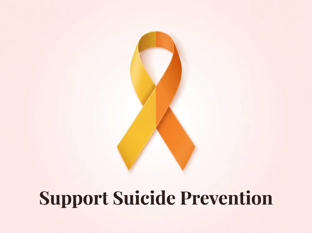 Yellow and orange suicide prevention awareness ribbon with the words Support Suicide Prevention